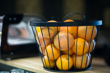 Basket full of oranges in the restaurant bar