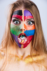 Young girl with pills on her tongue