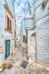 Alleyway in old white town Ostuni, Puglia, Italy