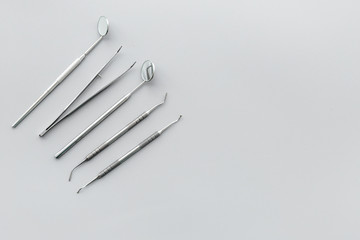 Dentist tools. Teethcare, dental health concept. Grey background top view copy space