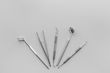 Dentist tools. Teethcare, dental health concept. Grey background top view copy space