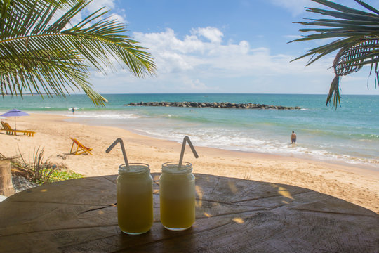 Beautiful beach. View of nice tropical beach with palms around. Holiday and vacation concept. Tropical beach.