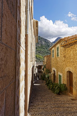 Narrow alley in spain on a sunny day with blue sky, Mallorca Europe