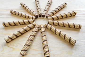 on the table lie waffle tubes in the shape of the sun