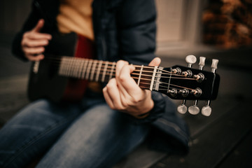 Girl with guitar in the woods