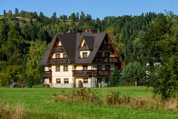 country house with oak trees