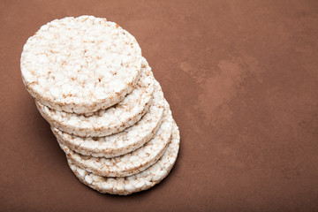 A stack of rice cake on a vintage brown style. Copy space.