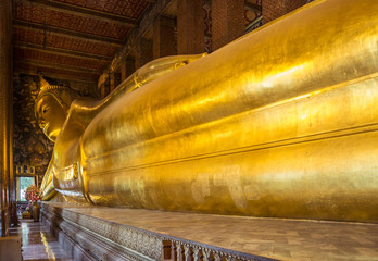 Giant reclining buddha at Wat Pho Temple in Bangkok