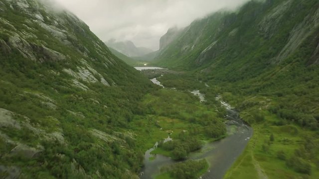 Breathtaking aerial view on the huge waterfall and the valley around it. 4k footage, bird view. Norway, Manafossen.