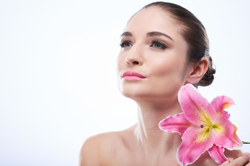 Fototapeta premium Beautiful woman with pink lily