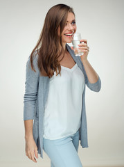 Smiling woman holding water glass. Isolated portrait on white