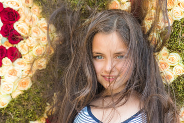 Beauty girl with long hair smile on floral background, spring