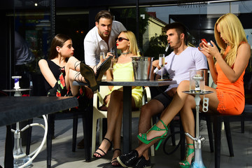 Man vapor hookah pipe in shisha bar lounge