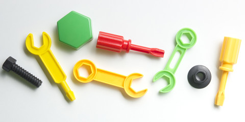 Kids educational developing toys frame on white background. Top view. Flat lay. Copy space for text