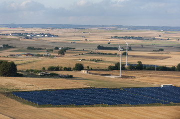 Obraz premium Solar panels and wind turbines