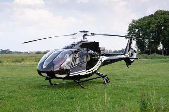 The Eurocopter EC 120B Colibri helicopter standing at the airport