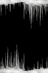 Icicles on a black background, space for text, template for design