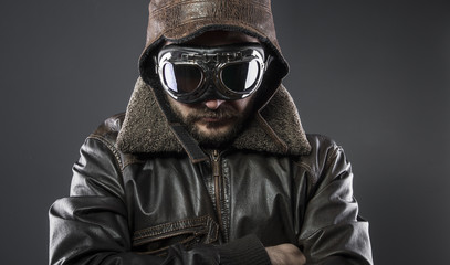 Army, recreation of the Second World War, old airplane pilot with brown leather jacket, cap of avidor and large glasses