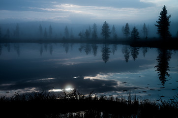 Calm reflections on a lake in Finnish Lapland