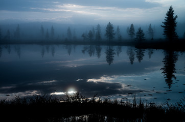 Fototapeta premium Calm reflections on a lake in Finnish Lapland