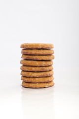 piles of round cookies on studio white background