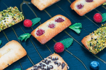 Vegan cakes decorated with mint and berries.