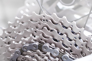Bicycle gear and disk brake detail, close up shot of new and clean silver mountainbike metal chain rings	