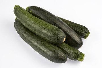 fresh green zucchini isolated on white background