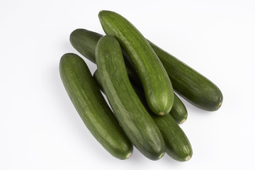 green cucumber on white background
