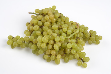 bunch of ripe and juicy green grapes close-up on a white background