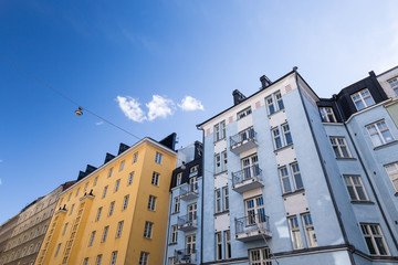 Building walls with windows on blue sky background