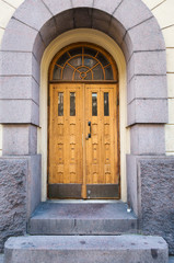 Wooden door in arch