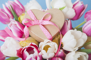 Heart-shaped gift and fresh Tulips