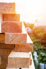 Wooden planks and timbers stacked in pile