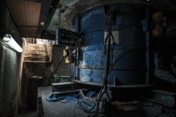 Fototapeta na wymiar underground giant concrete mixer drum with engine in concrete factory