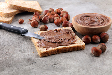 Homemade hazelnut spread in wooden bowl. Hazelnut Nougat cream