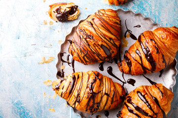   Breakfast Continental  with Fresh  Croissants with Chocolate and sauce on a blue Background  Delicious Baking Top View Copy space for Text