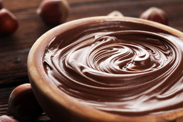 Homemade hazelnut spread in wooden bowl. Hazelnut Nougat cream