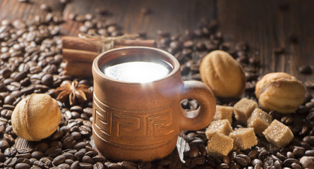 grains of coffee, cuddly cookies on a wooden background. Photography in low key