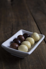 Chocolate balls on wooden table
