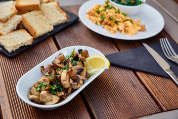 Snack from grated beans and greens, served with chopped mushrooms and seasoning, as well as slices of roasted homemade bread. Snack puree from legumes for spreading on toast.