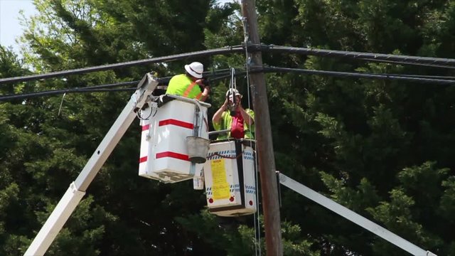 1966 Men Working on Power Lines in Slow Motion