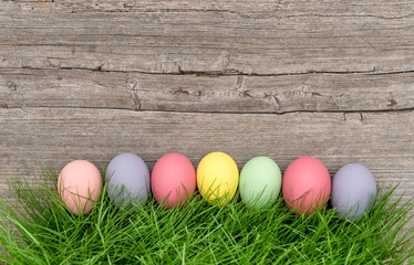 Easter eggs green grass rustic wooden background