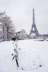 Fresh snow in Paris with bicycle