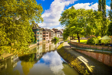 Fototapeta na wymiar Strasbourg, water canal in Petite France area, Unesco site. Alsace.