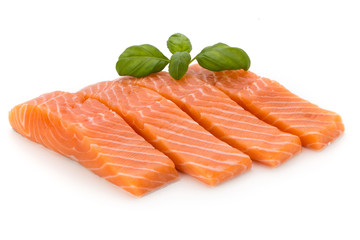 Fresh salmon fillet with basil on the white background.