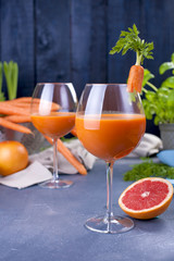 Cutlets from carrots for breakfast. Vegetarian healthy food. Spring vegetables and juices. Grapefruit and basil. Free space for text or a postcard.