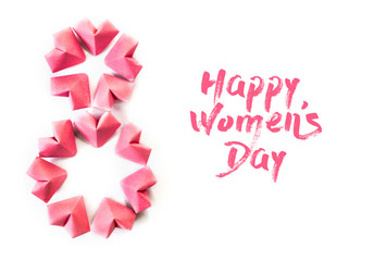 Happy International Women’s Day celebrate on March 8, congratulatory CARD. rose-color paper hearts shape figure eight 8 on white background 