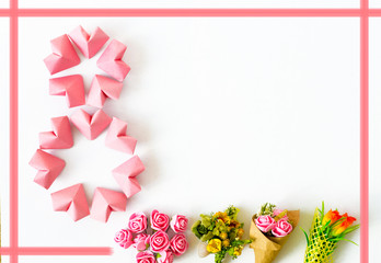 Happy International Women&rsquo;s Day celebrate on March 8, congratulatory CARD. rose-color paper hearts shape figure eight 8 on white background 