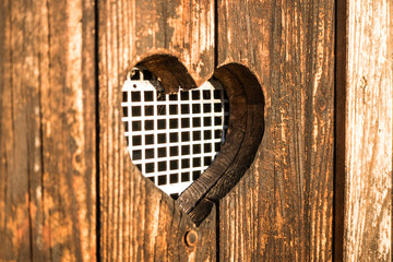 wooden heart on wood background